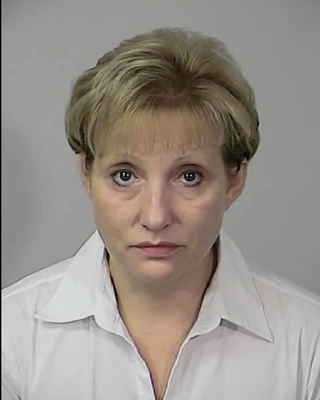 Woman pleads guilty in $355,000 embezzlement and sentenced to 18 months